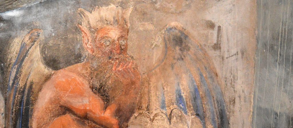 July 17, 2016-the Monastery of the Benedictines of Subiaco in the Lazio-Italy-Fresco from unidentified author depicting the devil who tries St. Benedict in the cave in the monastery of Subiaco